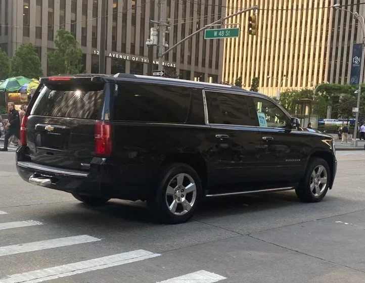 Black SUV driving in NYC