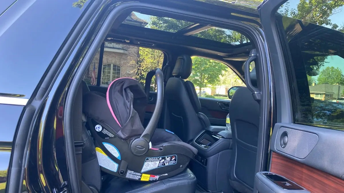 Child Car Seat Transportation New York in Black SUV
