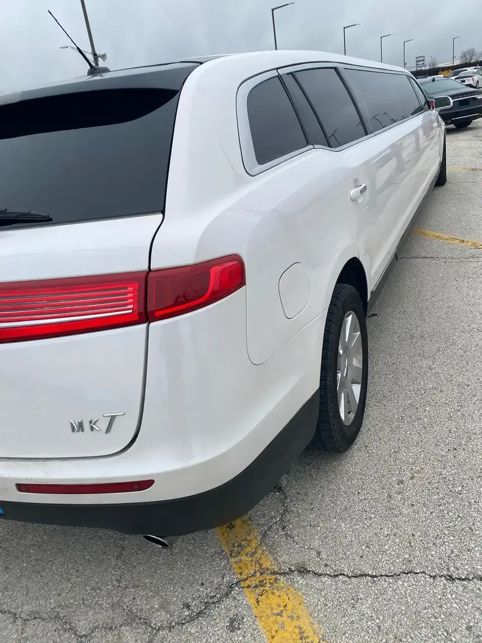 White Limo side parked
